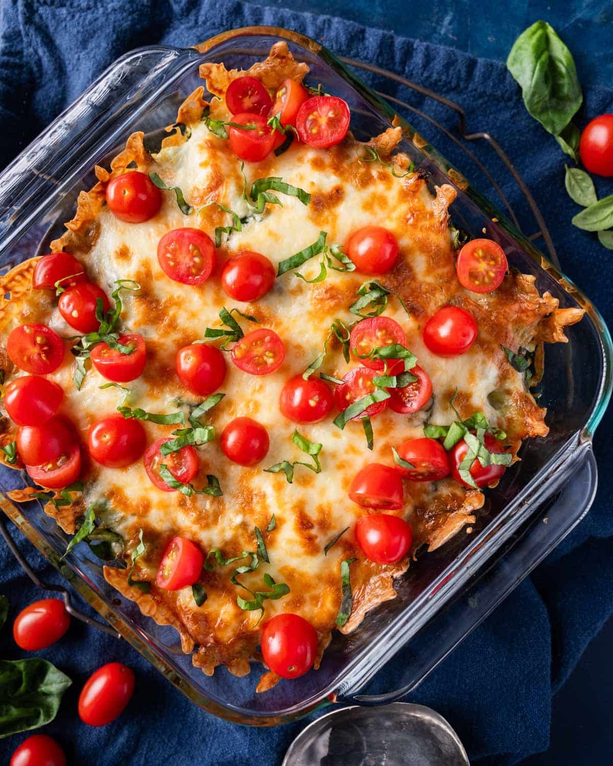 overhead view of pesto pasta casserole with tomatoes