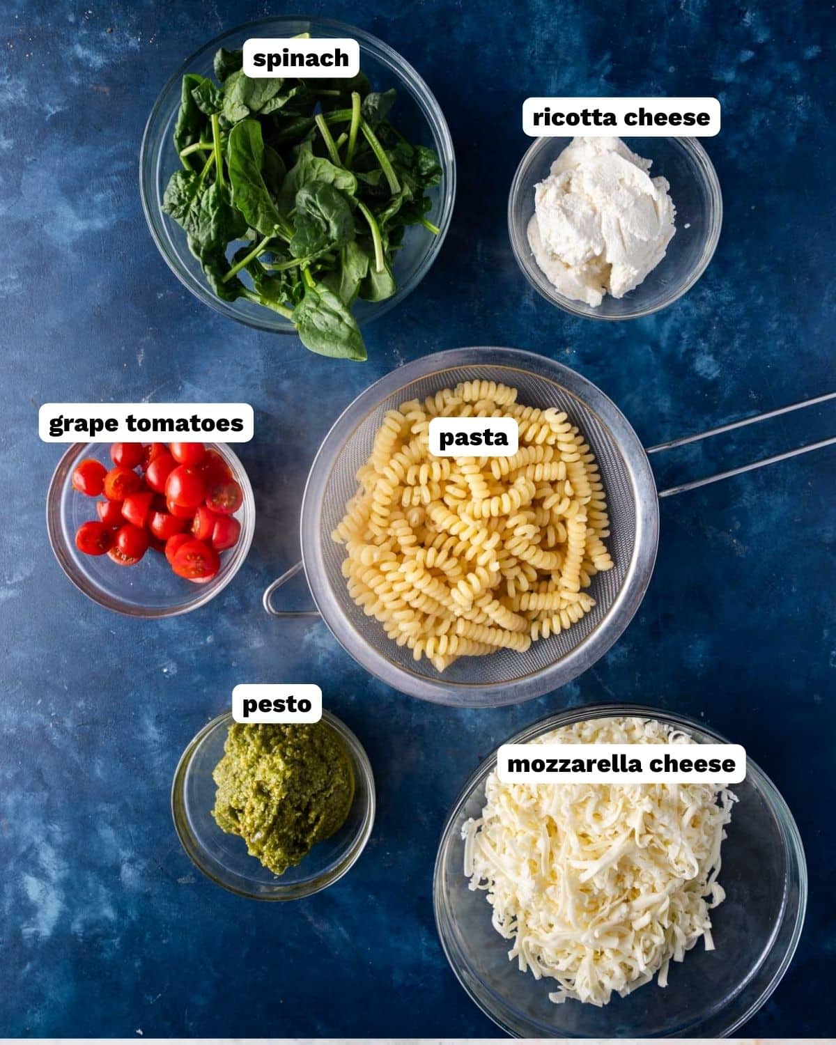 ingredients for pesto pasta bake on a table