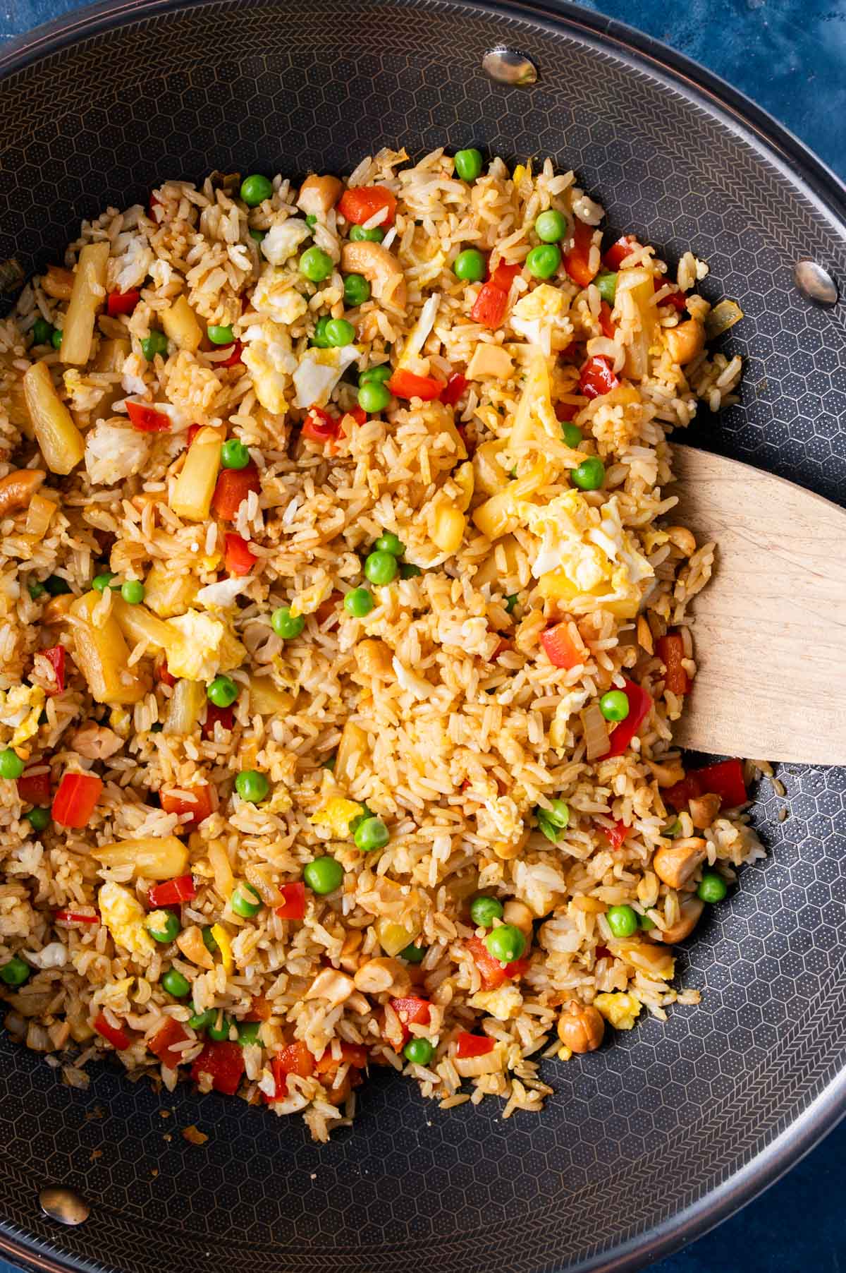 fried rice with pineapple and cashews in a saute pan