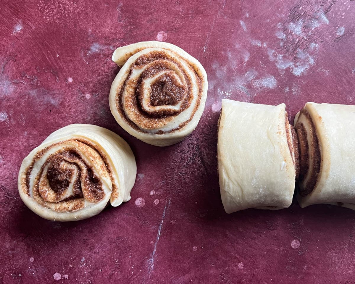 cinnamon rolls cut on a table