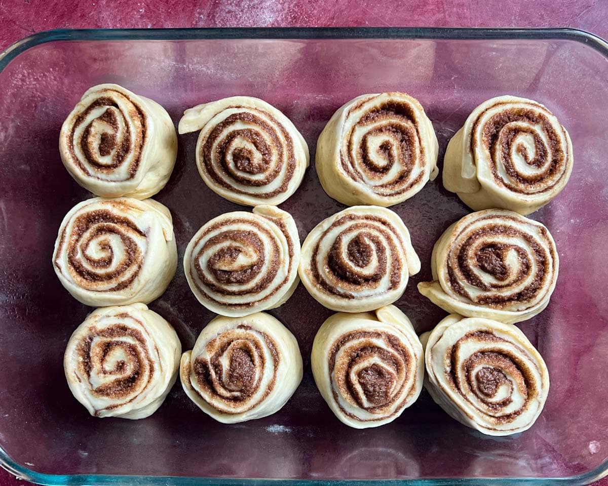 unbaked cinnamon roll in a pan