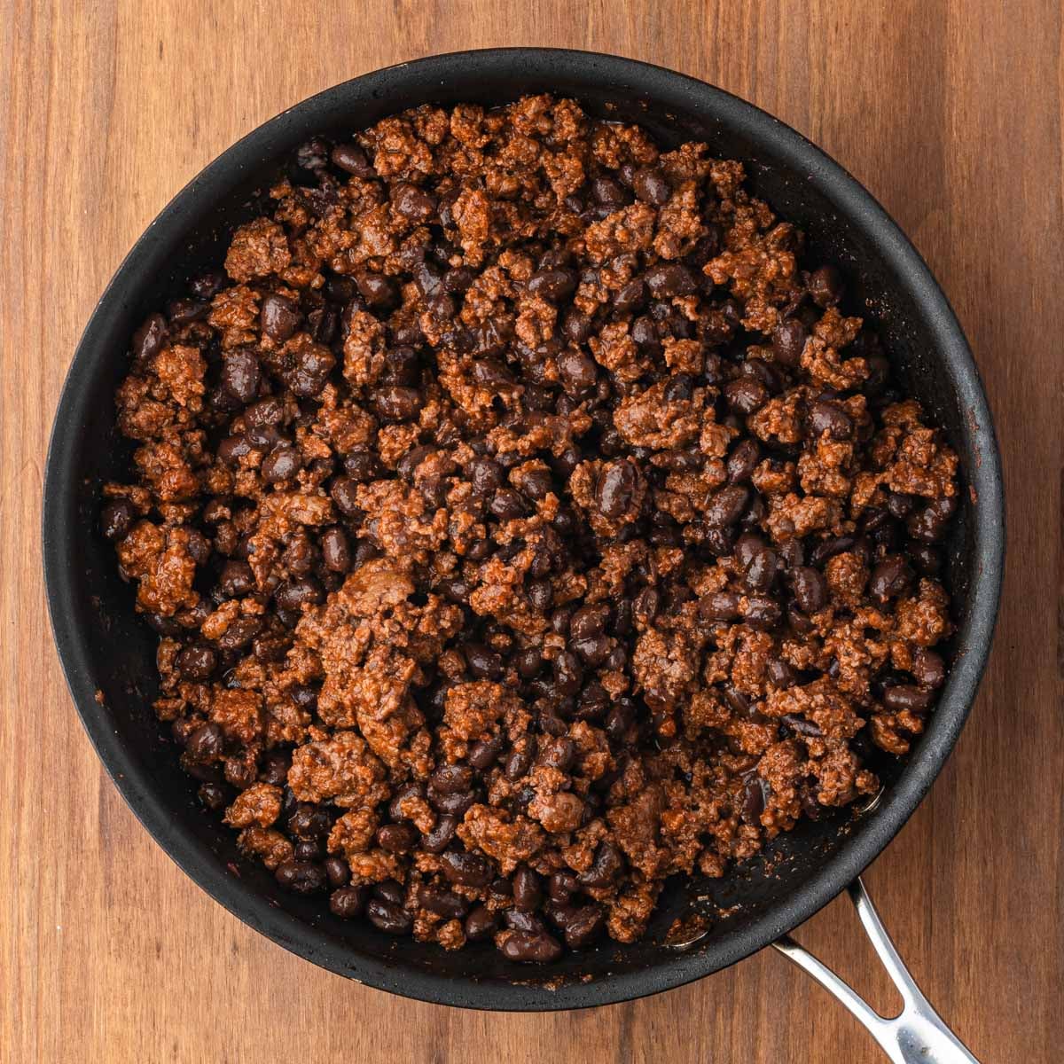 seasoned ground beef and black beans in a pan