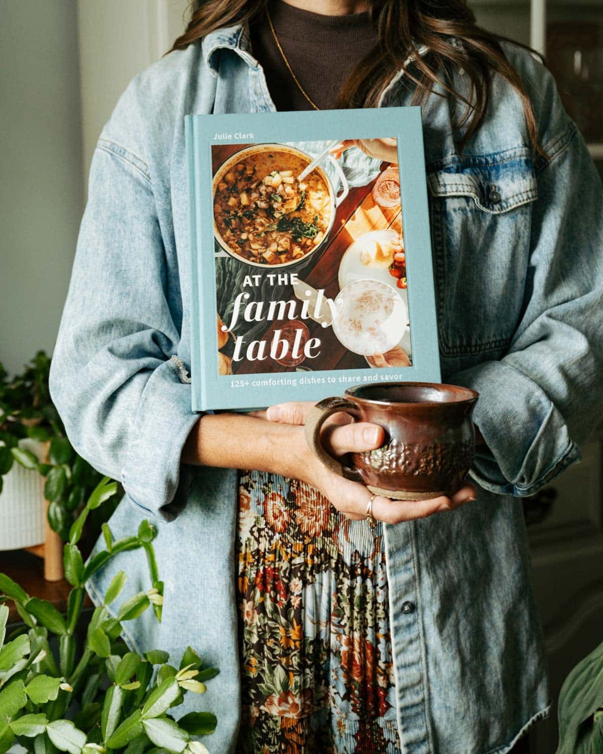 julie holding at the family table cookbook