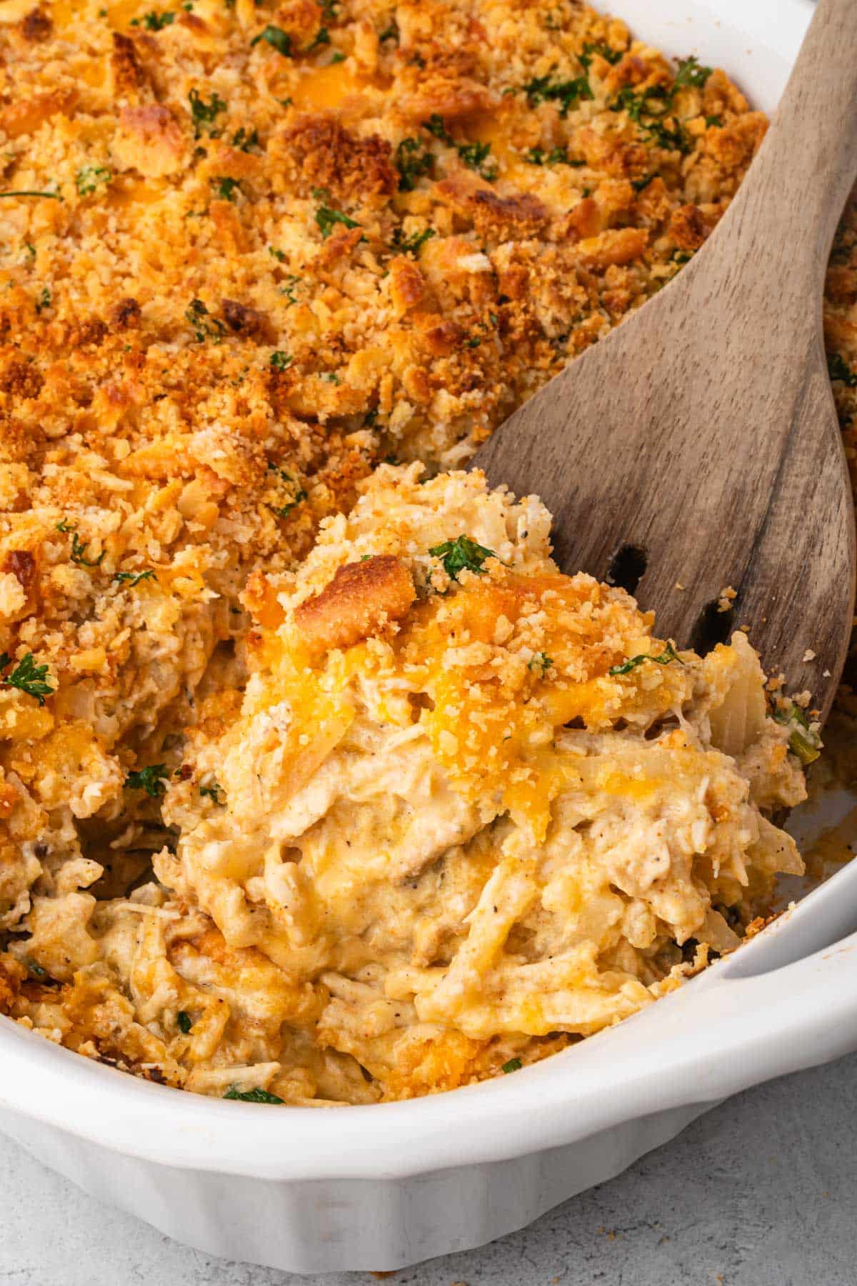 chicken and hash brown casserole on a spoon