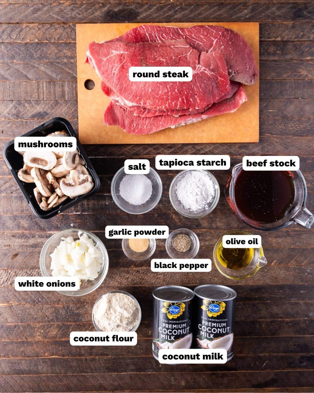 ingredients for slow cooker swiss steak on a table