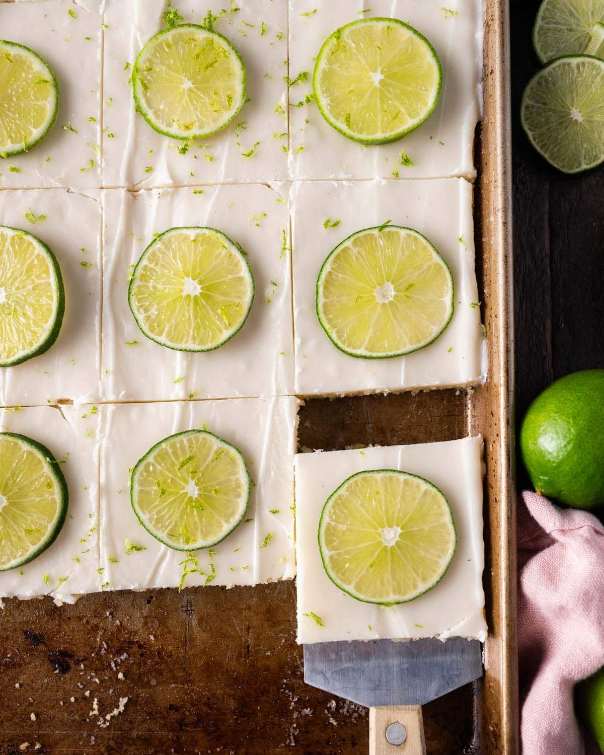overhead view of sliced key lime sheet cake