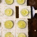 overhead view of key lime sheet cake with limes on top