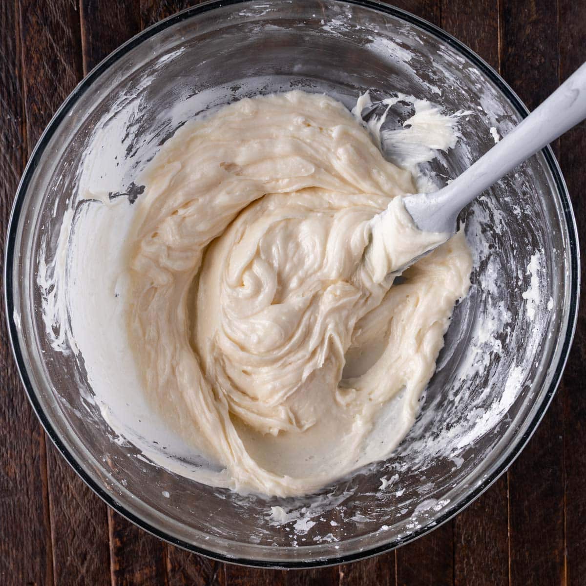 lime frosting in a bowl with a spatula