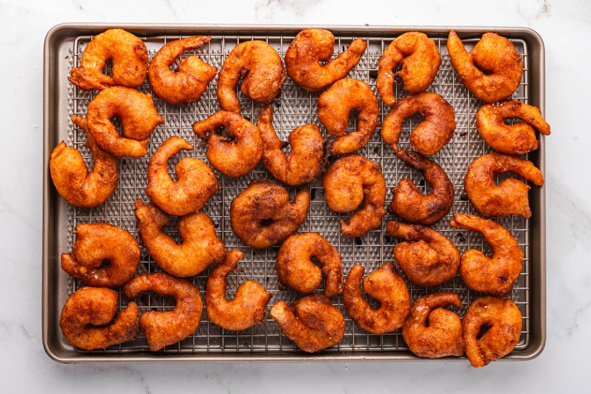 beer battered shrimp on a wire rack