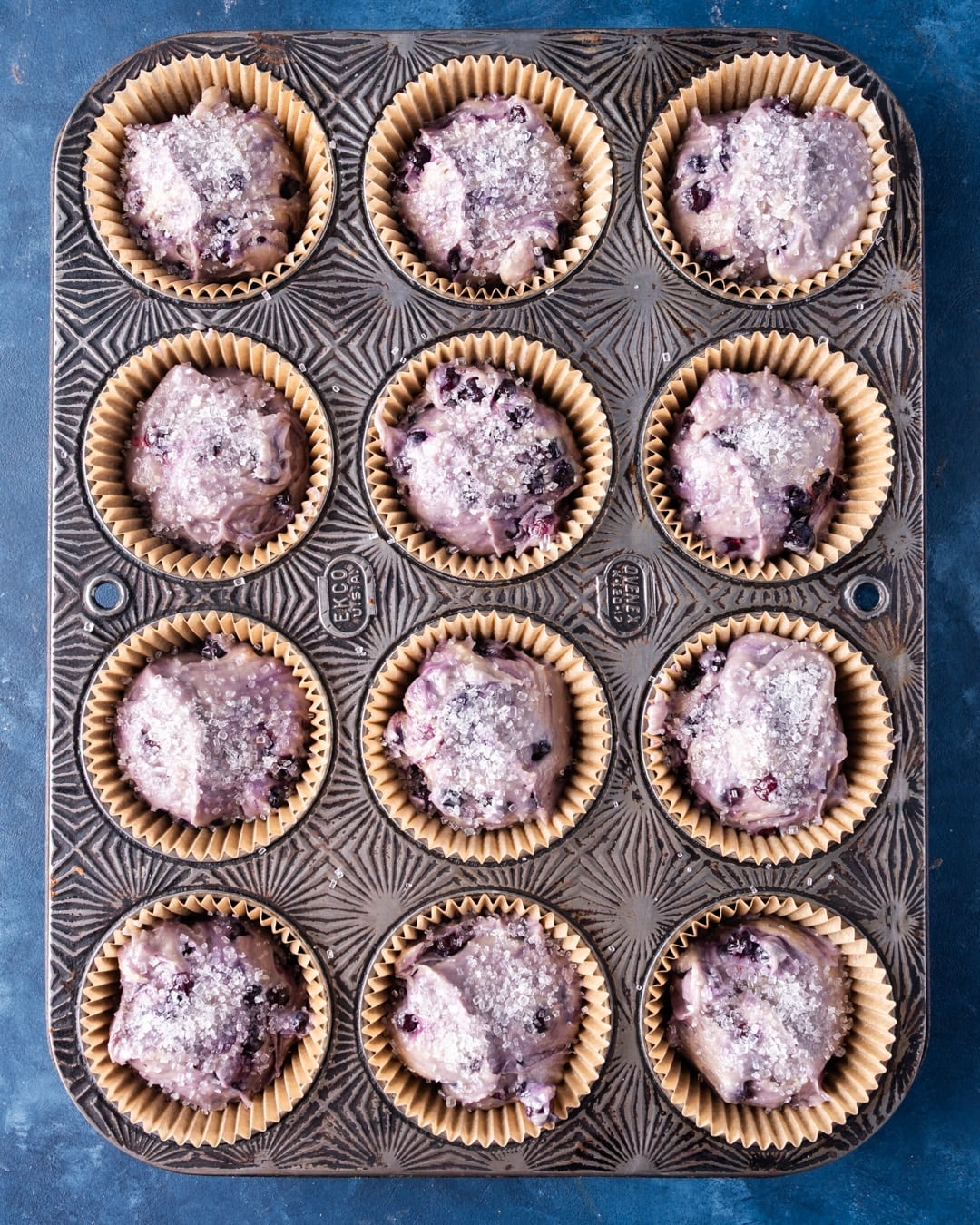 unbaked blueberry muffins in a pan