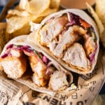 closeup of a chicken wrap with potato chips