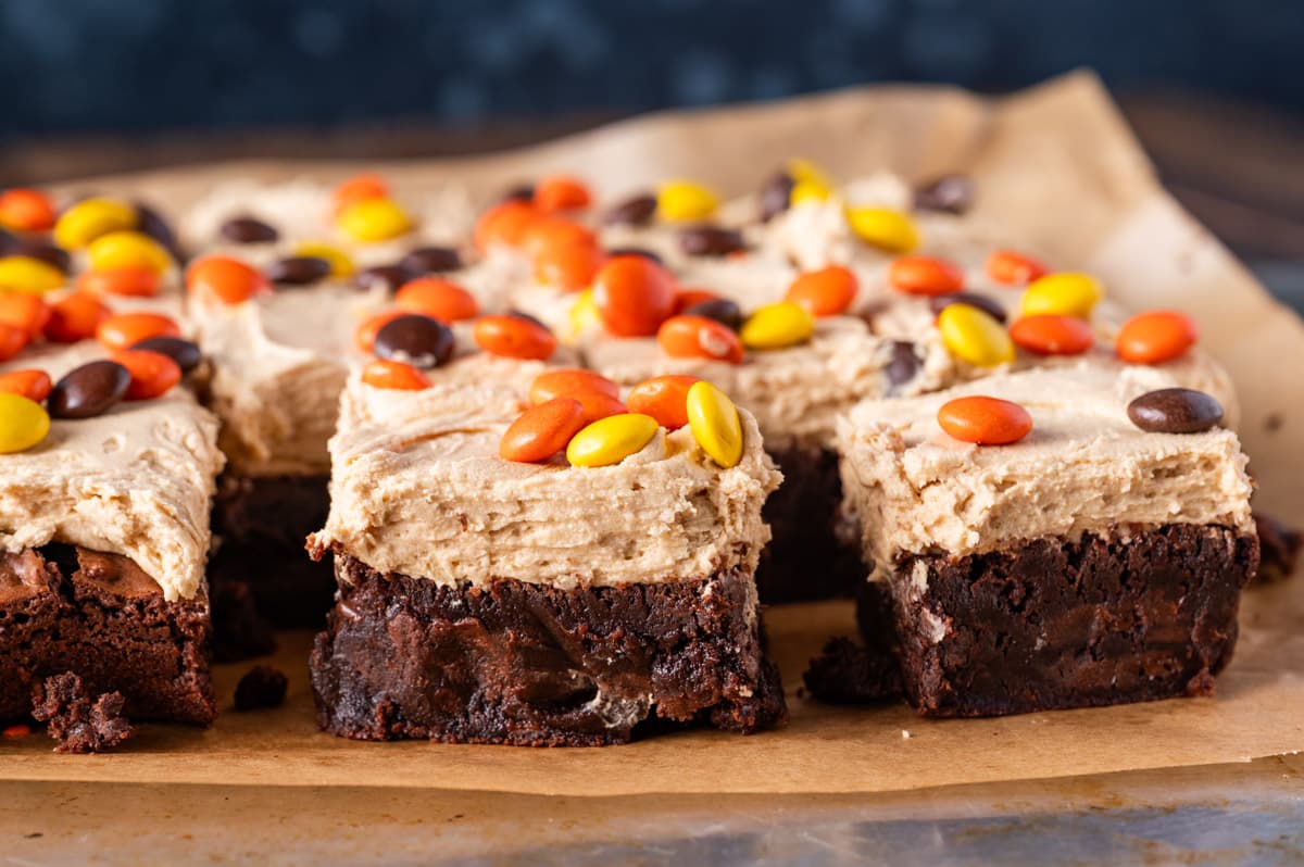 reese's pieces brownies on a piece of parchment paper