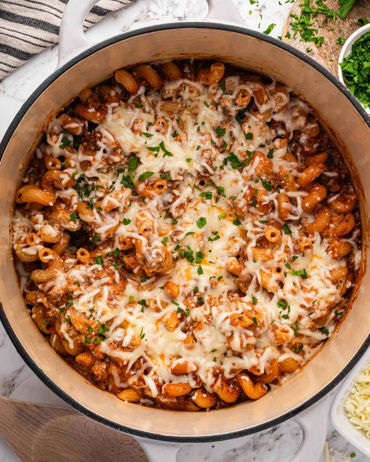 hamburger helper lasagna in a pot with cheese on top