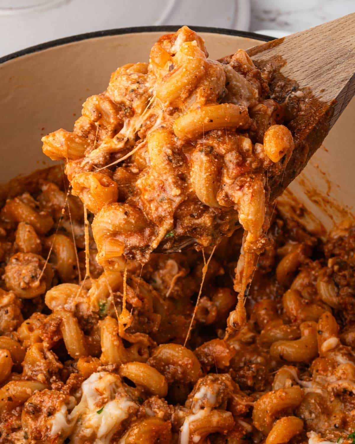 a spoon spooning out one pot macaroni lasagna