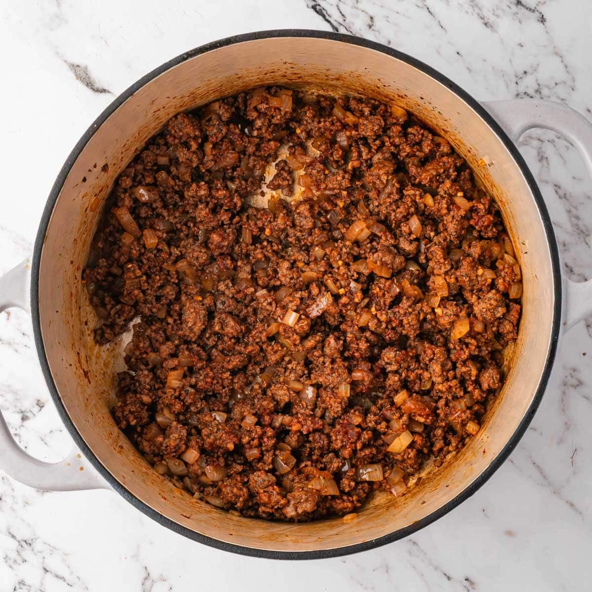 seasoned ground beef and onions in a pot