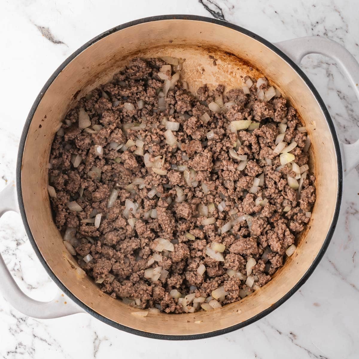 ground beef and onions browned in a pot