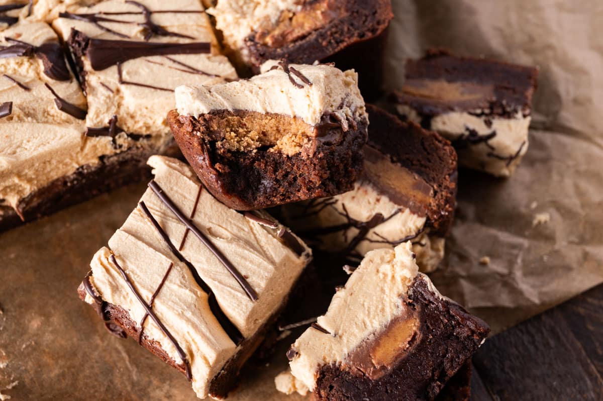 reese's stuffed brownies on a table, with one cut in half
