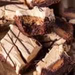 reese's stuffed brownies on a table, with one cut in half