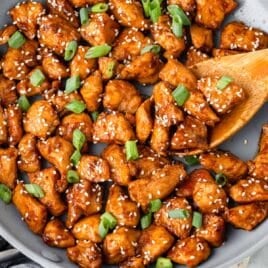 hoisin chicken in a skillet with a spatula