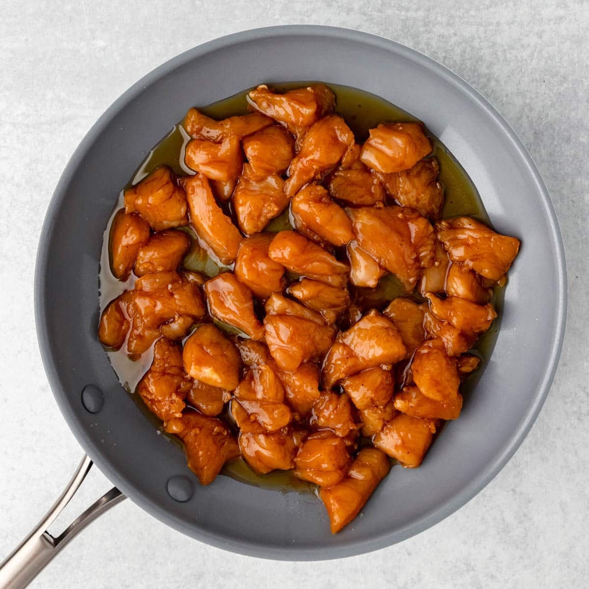 chicken with hoisin marinade in a skillet