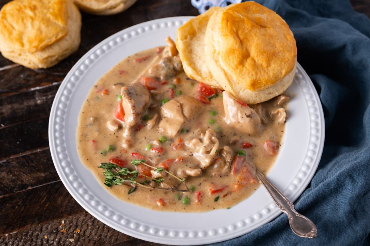 chicken a la king with a biscuit in a bowl