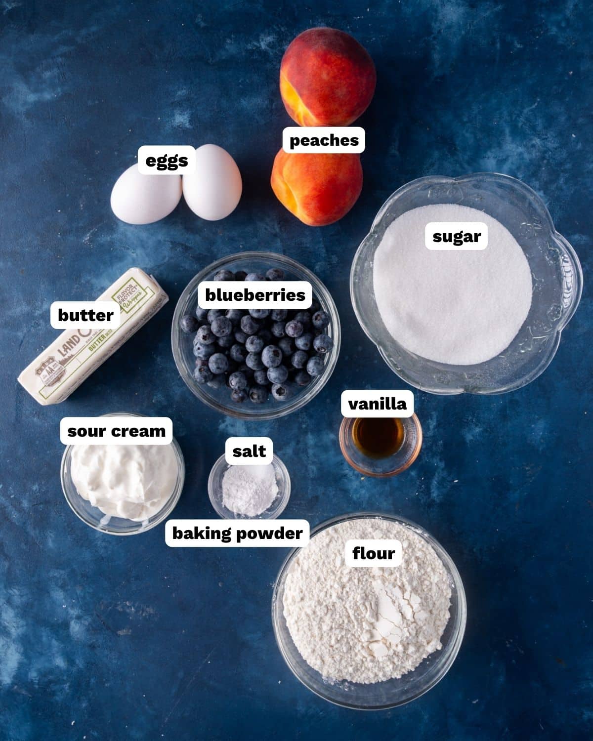 peach blueberry cake ingredients on a table