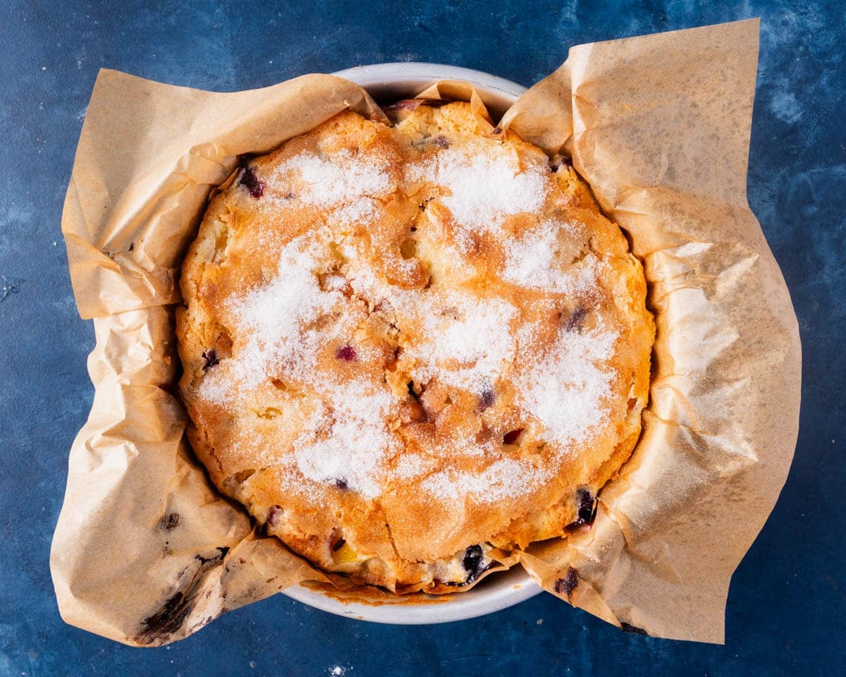 baked peach blueberry cake in a pan