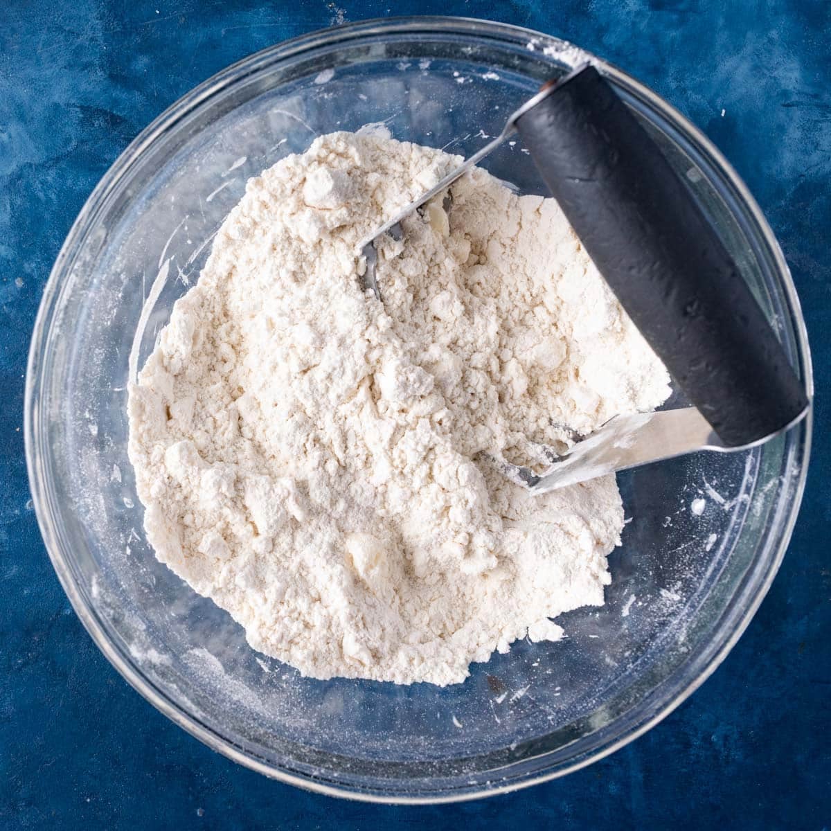 butter cut into flour in a mixing bowl
