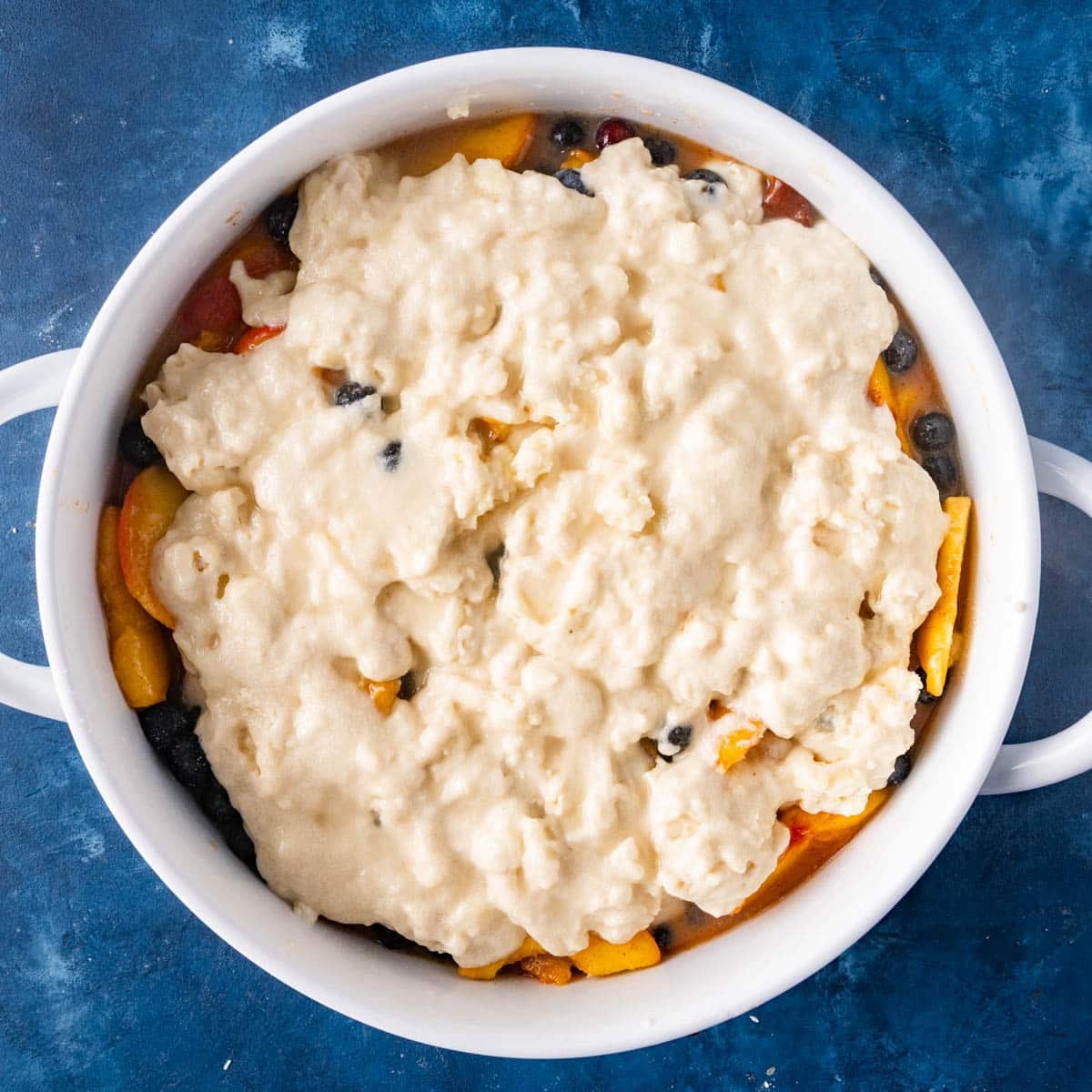 unbaked blueberry cobbler with peaches