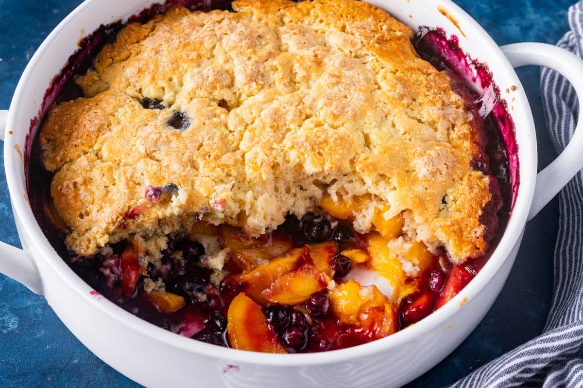 peach blueberry cobbler in a baking pan