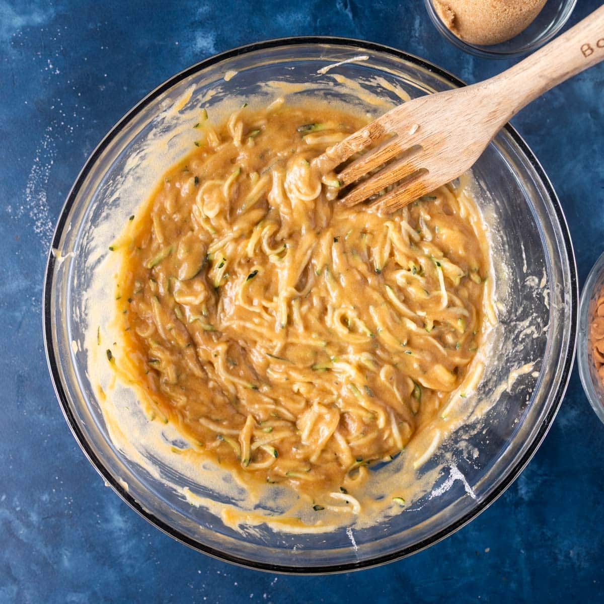 wet ingredients for zucchini bread mixed in a bowl