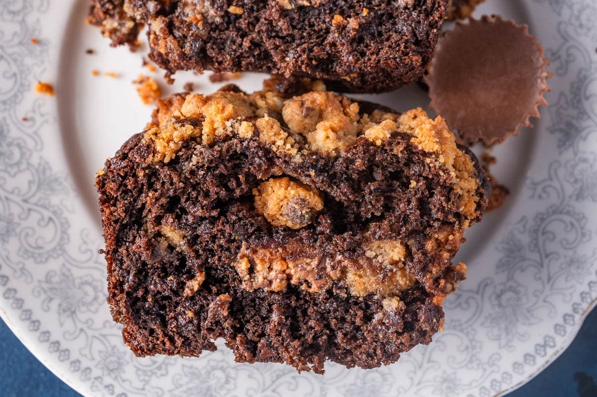 reese's chocolate zucchini muffin on a plate