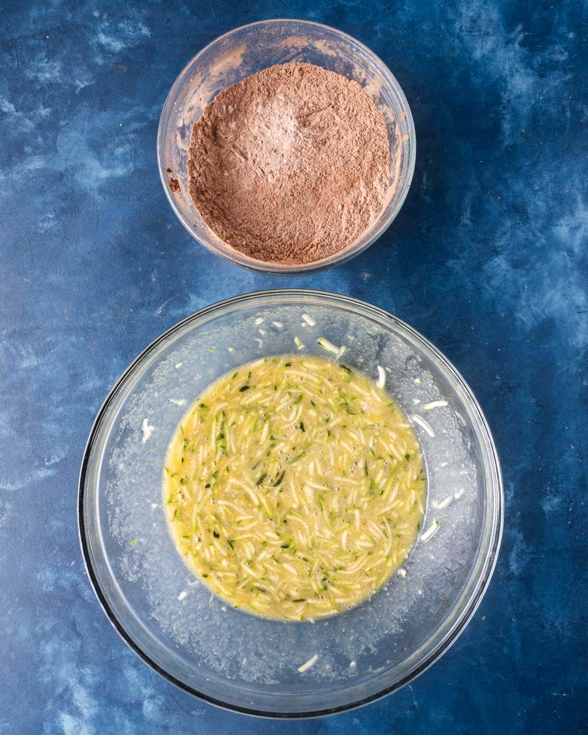 a bowl of dry ingredients and a bowl of wet ingredients on a table