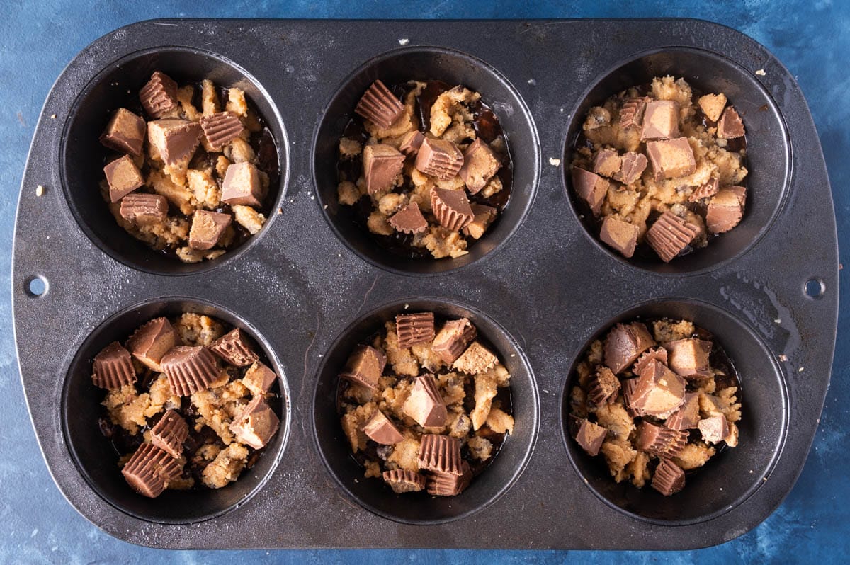 unbaked muffins with reese's inside