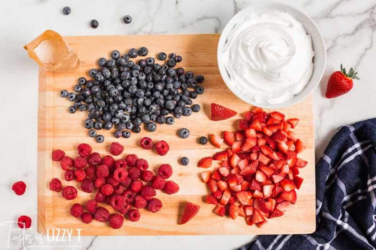 ingredients for triple berry fruit dip on a table