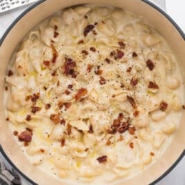 bacon and cracked pepper over white cheddar mac and cheese