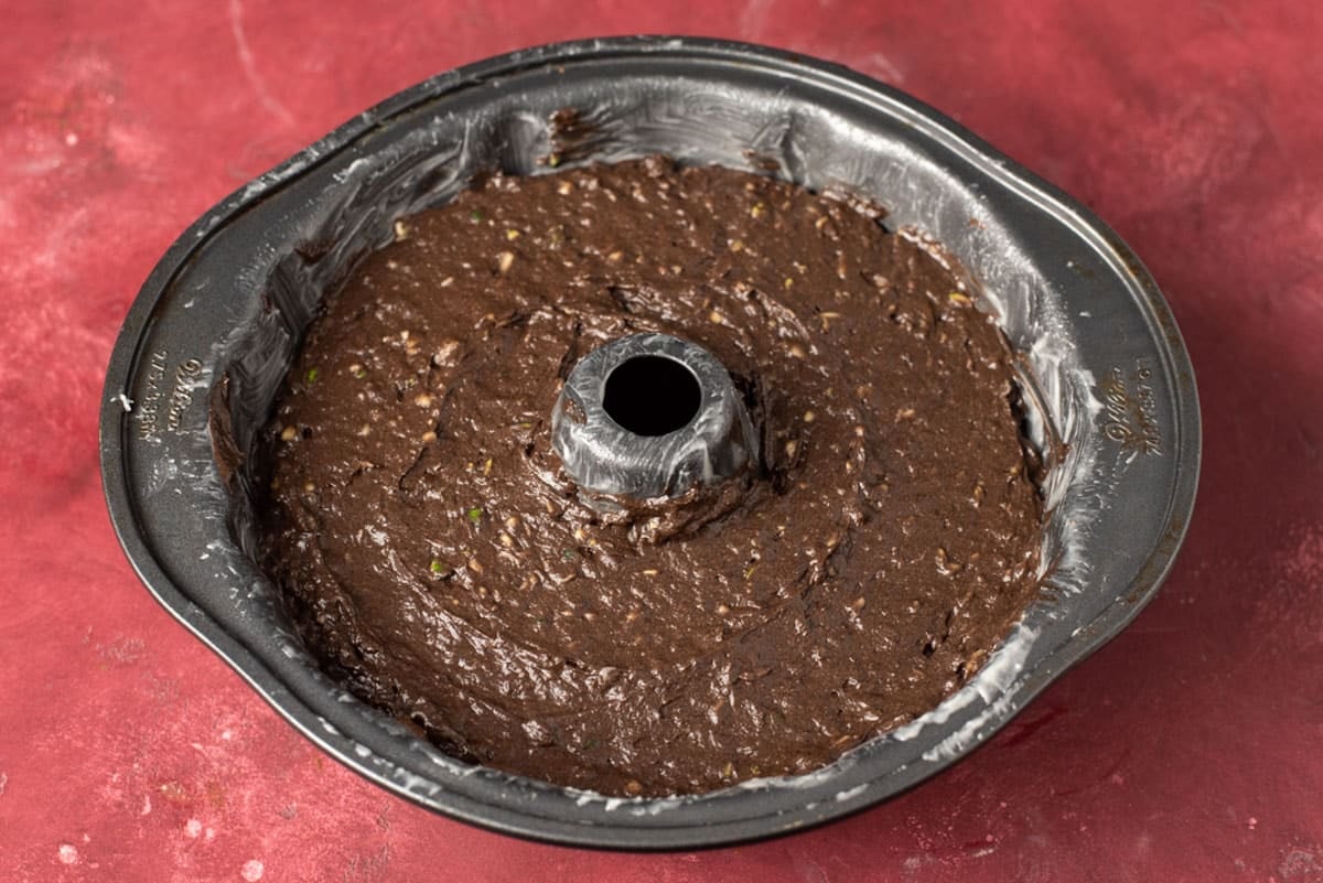 unbaked zucchini cake batter in a bundt cake pan
