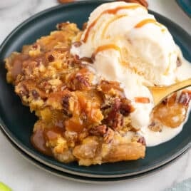 caramel apple dump cake on a plate with ice cream