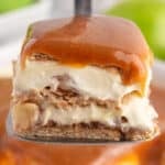 a piece of caramel apple eclair cake on a spatula