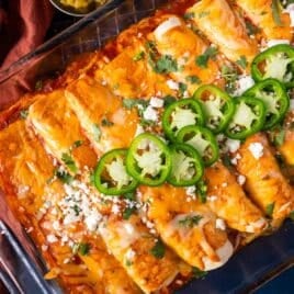 closeup of red enchiladas in a baking pan