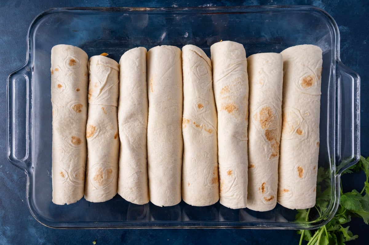tortillas with pork filling rolle dup in a pan