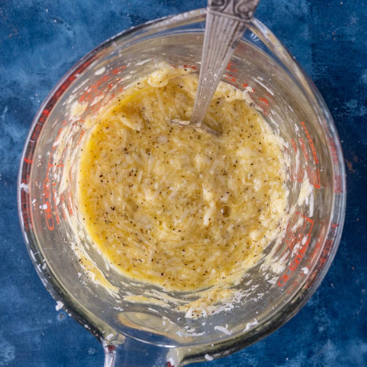egg and cheese mixture in a measuring cup