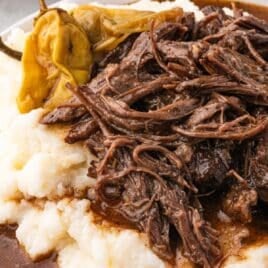 closeup of mississippi pot roast on potatoes