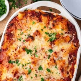 baked rigatoni and sausage in a white baking pan
