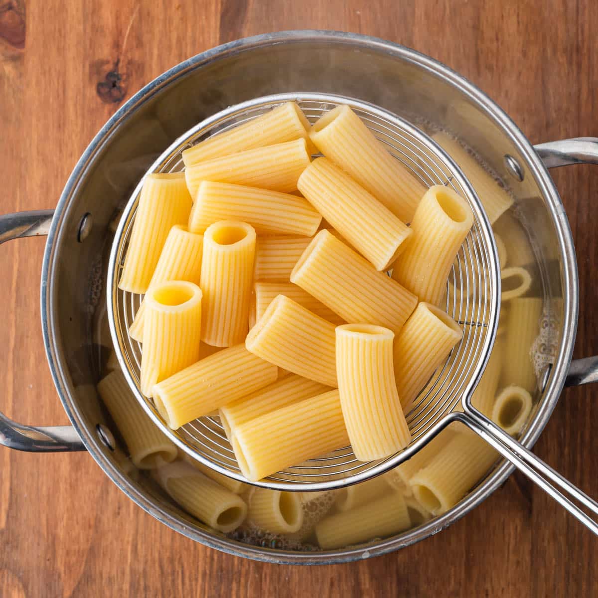 cooked rigatoni on a colander