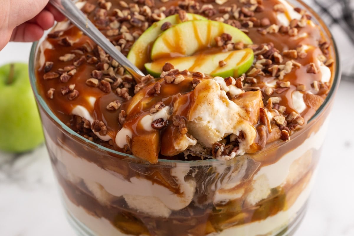 a spoon scooping out a caramel apple trifle