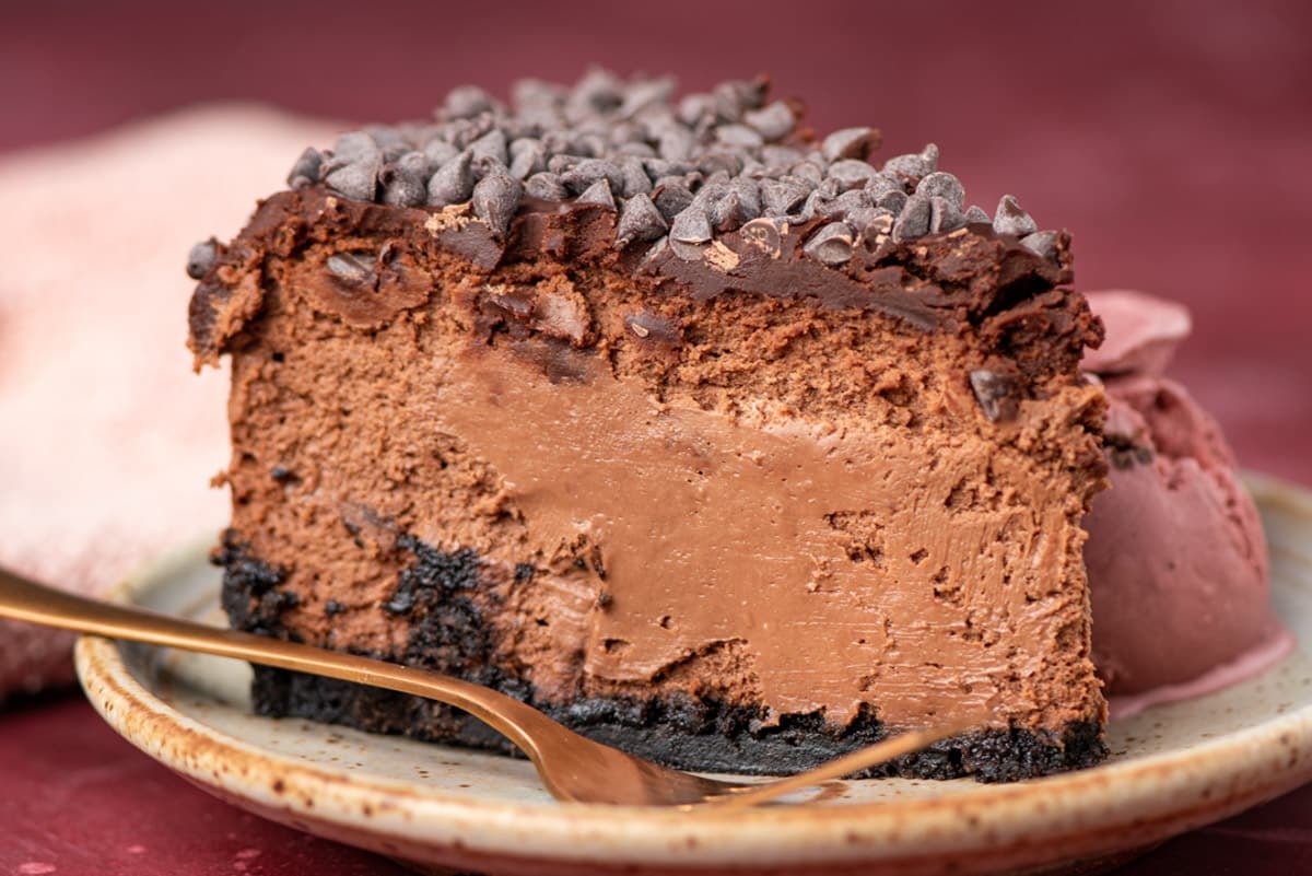 chocolate cheesecake with an oreo crust on a plate