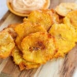 fried plantains on a cutting board