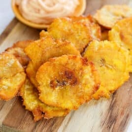 fried plantains on a cutting board