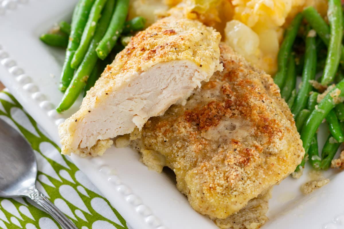 paleo baked chicken on a plate with green beans